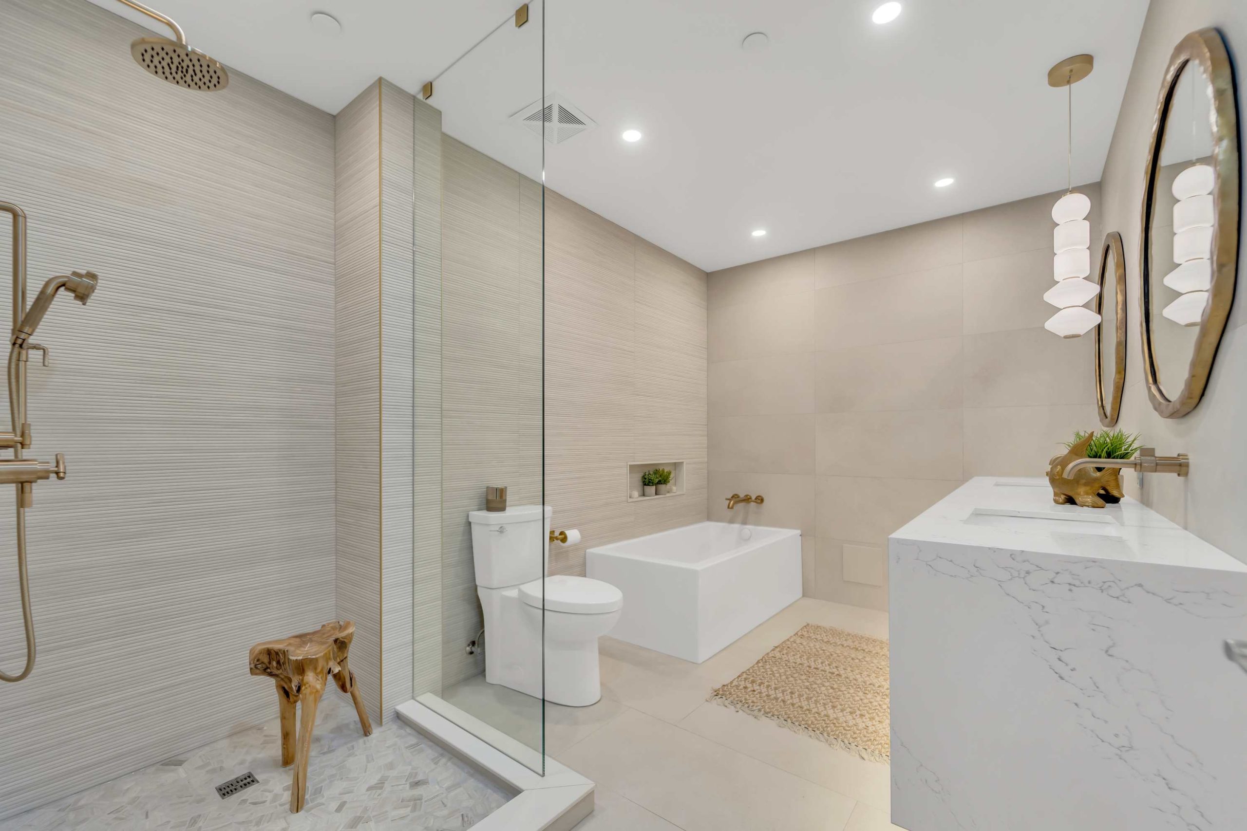 Luxury bathroom renovation with glass shower, freestanding tub and beige wall tiles Oakville Luxury bathroom renovation with glass shower, freestanding tub and beige wall tiles Oakville